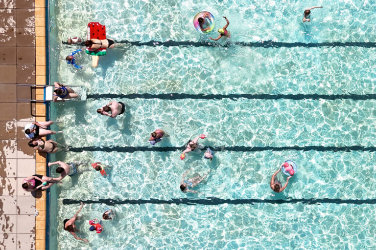 Swimmers keep cool in the hot weather in an open-air pool in Letchworth Garden City, Hertfordshire, England, Tuesday May 26, 2026. (Joe Giddens/PA via AP)