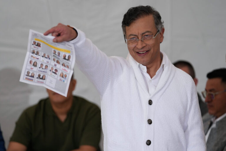 President Gustavo Petro shows a ballot during the presidential election in Bogota, Colombia, Sunday, May 31, 2026. (AP Photo/Matias Delacroix)