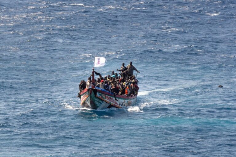 Migrants crowd a wooden boat as they sail to the port in La Restinga on the Canary island of El Hierro, Spain, Sunday, Aug. 18, 2024. (AP Photo/Maria Ximena, File)