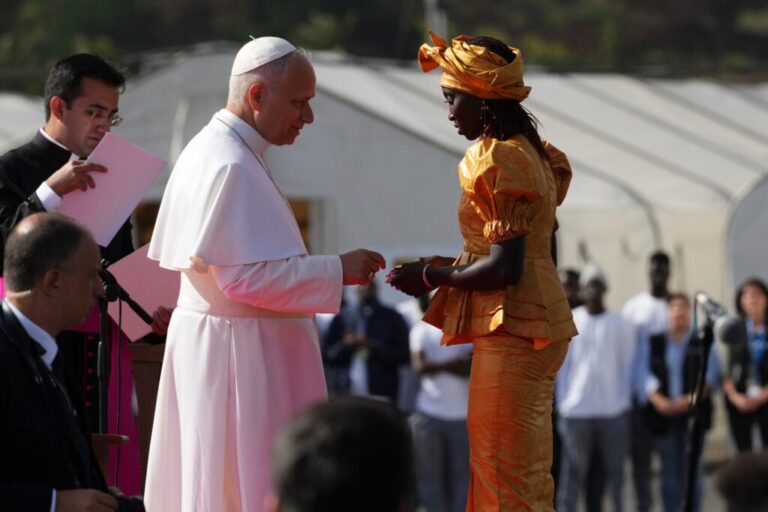 Pope Leo XIV meets a migrant at the 'Las Raices' center, in San Cristobal de la Laguna, Tenerife, Spain, Friday, June 12, 2026. (AP Photo/Alessandra Tarantino)