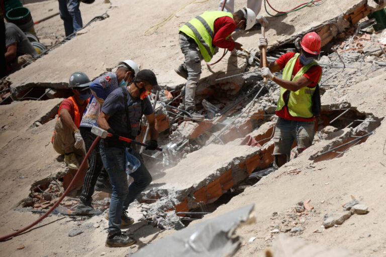 Rescue worker search through the rubble of a collapsed building two days after earthquakes struck Caracas, Venezuela, Friday, June 26, 2026. (AP Photo/Pedro Mattey)