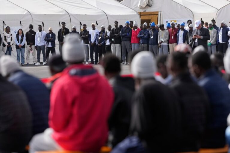 Migrants attend a meeting with Pope Leo XIV at the 'Las Raices' center, in San Cristobal de la Laguna, Tenerife, Spain, Friday, June 12, 2026. (AP Photo/Alessandra Tarantino)