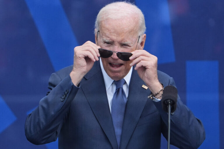 Former President Joe Biden looks out at the crowd during the dedication ceremony for the Obama Presidential Center, Thursday, June 18, 2026, in Chicago. (AP Photo/Jeff Roberson)