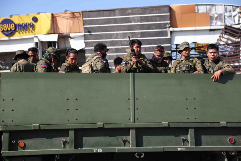Soldiers secure a damaged building following an earhtquake in General Santos, Philippines Tuesday, June 9, 2026. (AP Photo/Basilio Sepe)