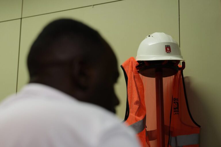 A former Caddell worker, who asked that his name not be published, speaks with The Associated Press during an interview in Milan, Italy, Monday, June 8, 2026. (AP Photo/Antonio Calanni)ok