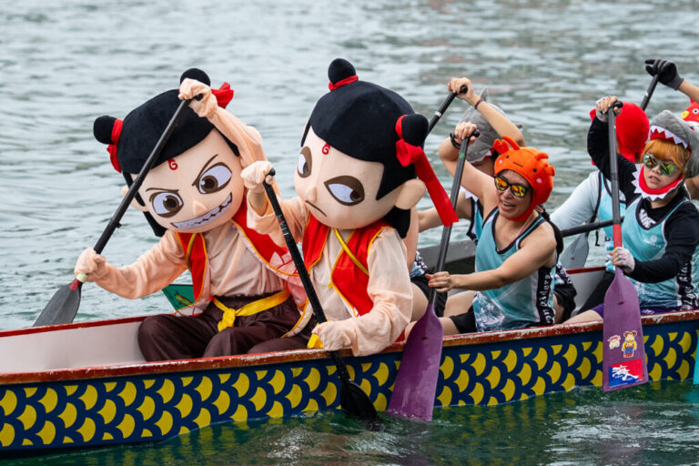 Competitors in Nezha and other costumes take part in the Aberdeen Dragon Boat Race to celebrate the Dragon Boat Festival in Hong Kong, Friday, June 19, 2026. (AP Photo/Chan Long Hei)