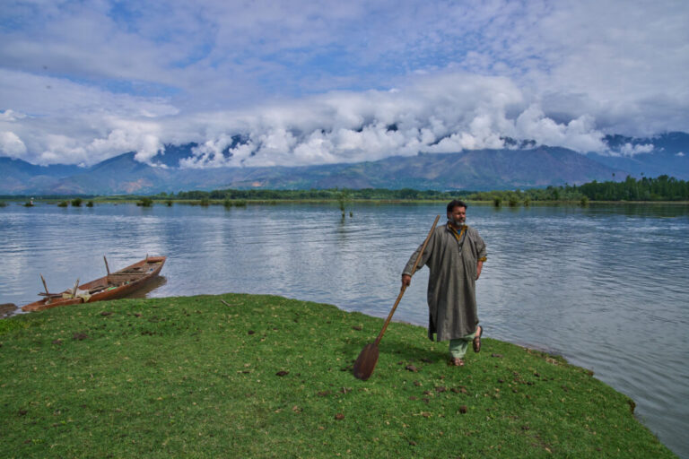 Bashir Ahmed, a Kashmiri fisher, stands on an island in Wular Lake in Bandipora, northeast of Srinagar, Indian controlled Kashmir, Tuesday, May 5, 2026. (AP Photo/Dar Yasin)