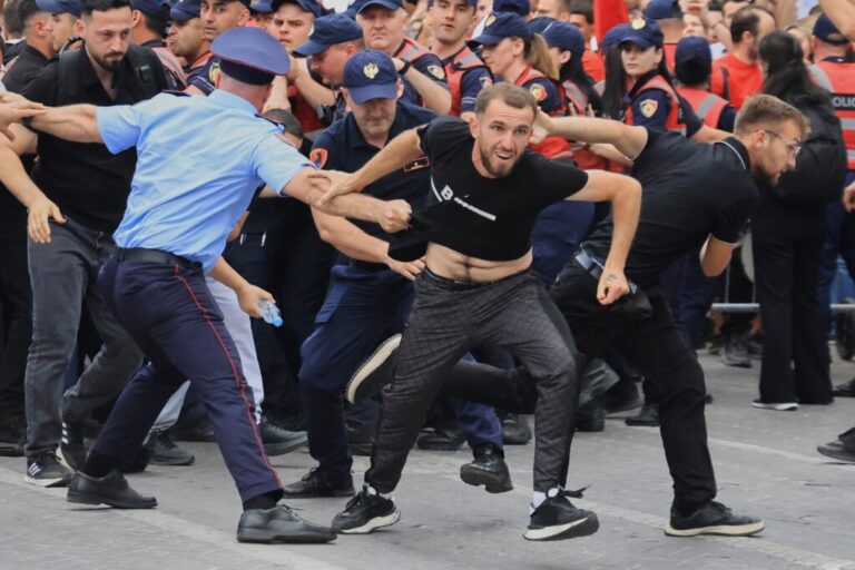 Protesters scuffle with police officers blocking a street during a demonstration in Tirana, Albania, Wednesday, June 3, 2026, opposing a luxury coastal development project linked to Jared Kushner and Ivanka Trump over concerns about environmental impacts and transparency.(AP Photo/Hameraldi Agolli)