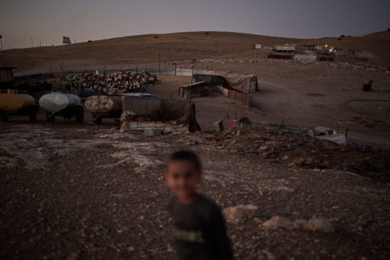 An Israeli settler outpost, top right, overlooks a Palestinian compound at dusk in the northern Jordan Valley in the occupied West Bank, Tuesday, June 23, 2026. (AP Photo/Leo Correa)
