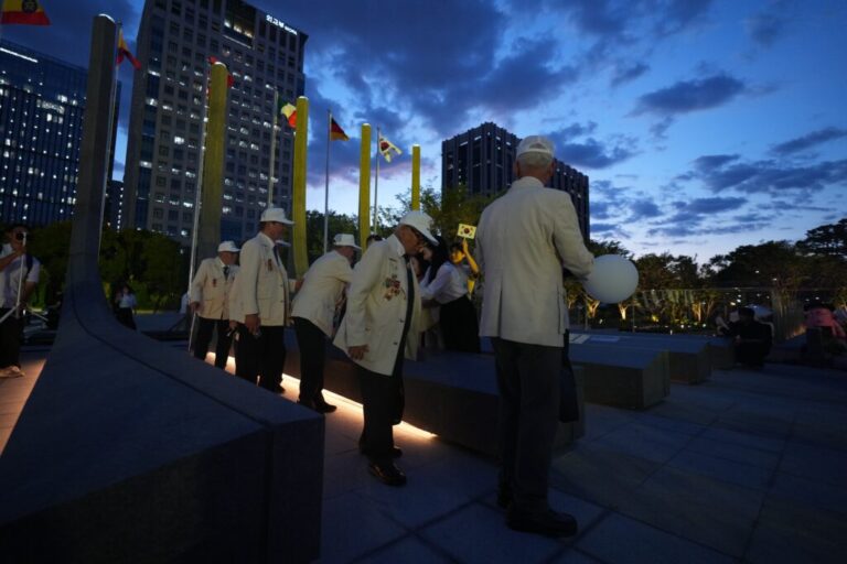 Korean War veterans are greeted after a ceremony to mark the 76th anniversary of the outbreak of the Korean War in Seoul, South Korea, Tuesday, June 23, 2026. (AP Photo/Lee Jin-man)