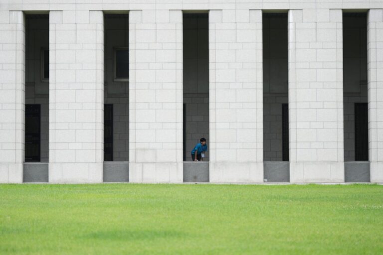 South Korean student Min Woo-jin looks at monuments with the names of soldiers killed during the 1950-53 Korean War, at the War Memorial of Korea in Seoul, South Korea, Sunday, July 5, 2026. (AP Photo/Lee Jin-man)
