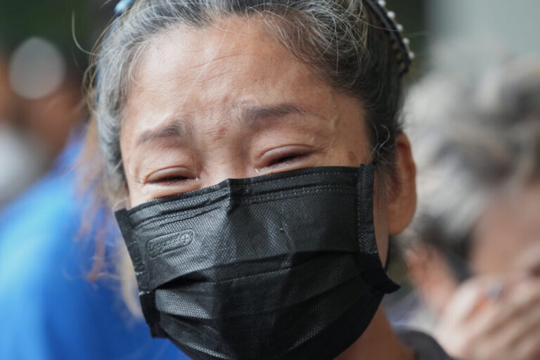One of relatives of fire victims cries during an interview at the Institute of Forensic Police hospital in Bangkok, Thailand, Monday, July 13, 2026, following a fire at a beer hall. (AP Photo/Sakchai Lalit)