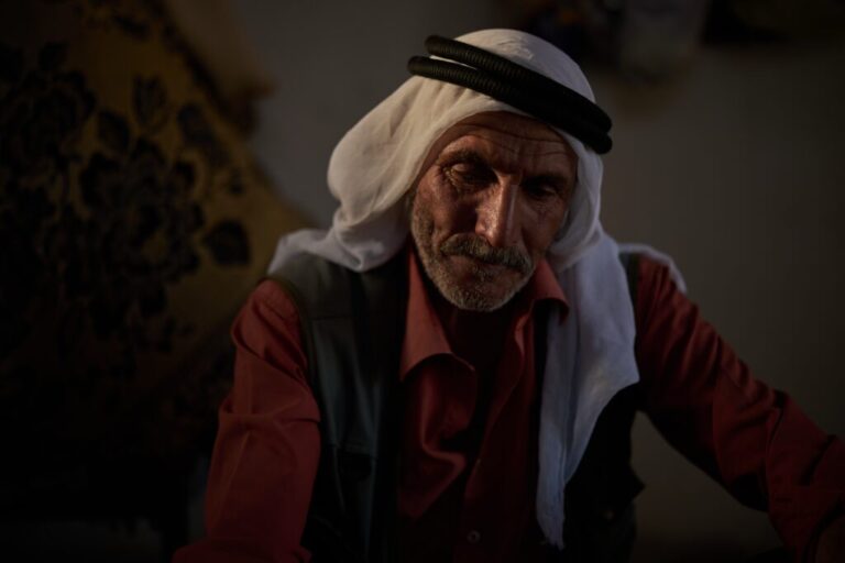 Jibrin Abu Aram, 62, looks down as he talks about settlers attacks in his community near the West Bank village of Susya, in the Masafer Yatta region, Wednesday, June 17, 2026.