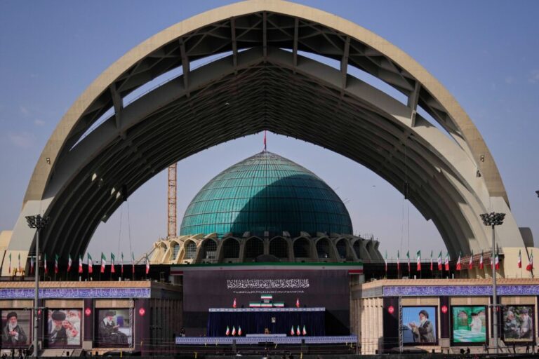 The coffins of slain Iranian Supreme Leader Ayatollah Ali Khamenei and members of his family are displayed on a stand at the start of the dayslong funeral ceremonies at the Imam Khomeini Mosalla Grand Mosque in Tehran, Iran, Saturday, July 4, 2026. (AP Photo/Altaf Qadri)