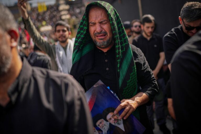 A mourner weeps as he attends the start of the dayslong funeral ceremonies for slain Iranian Supreme Leader Ayatollah Ali Khamenei and members of his family at the Imam Khomeini Mosalla Grand Mosque in Tehran, Iran, Saturday, July 4, 2026. (AP Photo/Altaf Qadri)