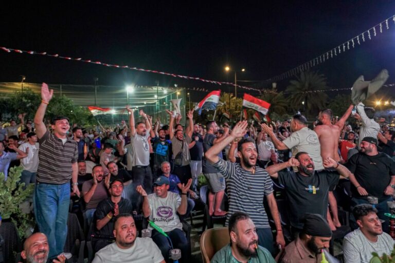 Iraqi soccer fans react as they watch the World Cup match between Iraq and Norway on a large screen in downtown Baghdad, Iraq, early Wednesday, June 17, 2026. (AP Photo/Anmar Khalil)