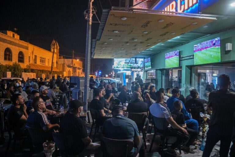 Soccer fans watch the World Cup Group I match between Senegal and Iraq at an outdoor cafe in downtown Baghdad, Iraq, Friday, June 26, 2026. (AP Photo/Adil al-Khazali)