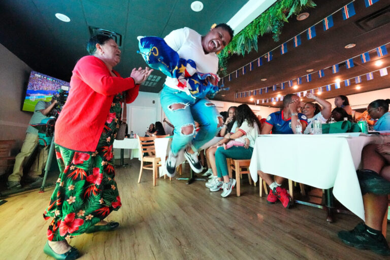 Cape Verde supporters celebrate as they watch the World Cup Group H soccer match between Uruguay and Cape Verde at a restaurant at a Cape Verde community in Brockton, Mass. near Boston, Sunday, June 21, 2026. (AP Photo/Martin Meissner)