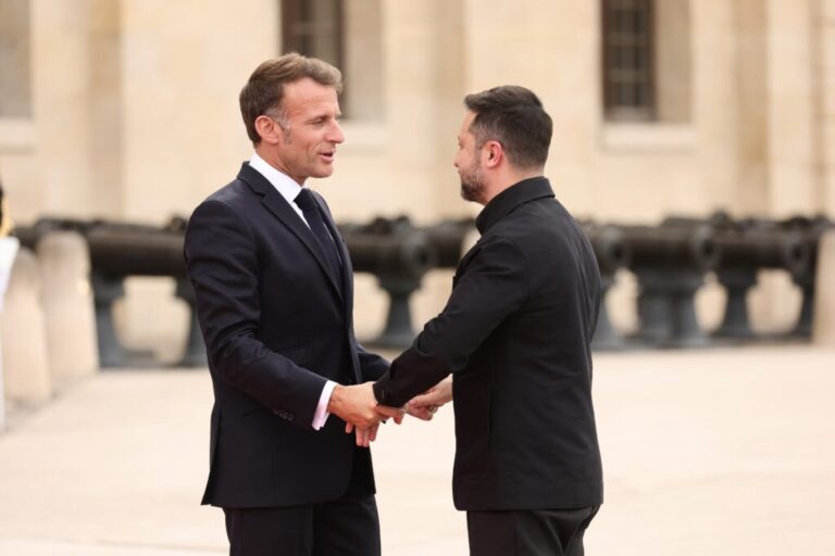 French President Emmanuel Macron greets Ukrainian President Volodymyr Zelensky ahead of the Coalition of the Willing summit on security guarantees for Ukraine at the Hotel des Invalides in Paris, France, Monday, July 13, 2026. (Teresa Suarez/POOL photo via AP)