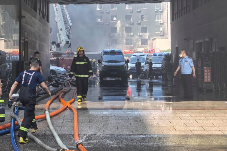 In this photo released by Xinhua News Agency, firefighters at the scene of a footwear factory fire in Jiangtou village, Chendai township of Jinjiang city, southeastern China's Fujian province, Thursday, July 9, 2026. (Zheng Liang/Xinhua via AP)