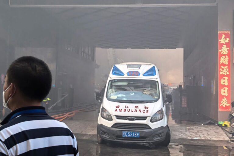 In this photo released by Xinhua News Agency, an ambulance waits at the scene of a footwear factory fire in Jiangtou village, Chendai township of Jinjiang city, southeastern China's Fujian province, Thursday, July 9, 2026. (Zheng Liang/Xinhua via AP)