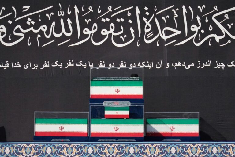 The coffins of slain Iranian Supreme Leader Ayatollah Ali Khamenei and members of his family are displayed on a platform at the start of the dayslong funeral ceremonies at the Imam Khomeini Mosalla Grand Mosque in Tehran, Iran, Saturday, July 4, 2026. (AP Photo/Altaf Qadri)