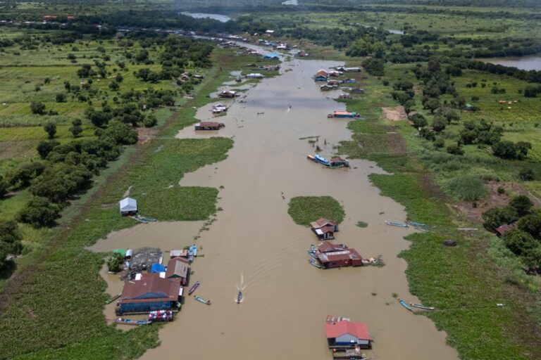 Boats traverse a floating village on Cambodia's Tonle Sap Lake on Monday, June 29, 2026. (AP Photo/Anton L. Delgado)