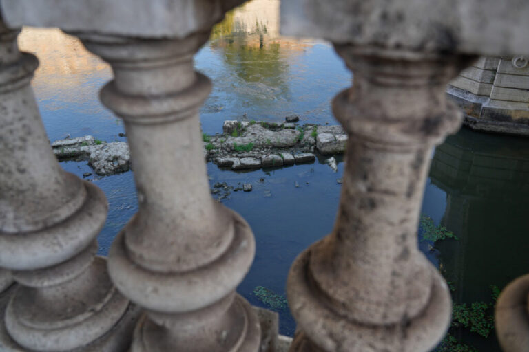 The ruins of the ancient Roman Neronian bridge, emerge from the riverbed of the Tiber river due to drought, in Rome, Thursday, Aug. 13, 2026. (AP Photo/Gregorio Borgia)
