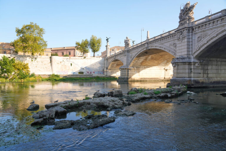 The ruins of the ancient Roman Neronian bridge, emerge from the riverbed of the Tiber river due to drought, in Rome, Thursday, Aug. 13, 2026. (AP Photo/Gregorio Borgia)