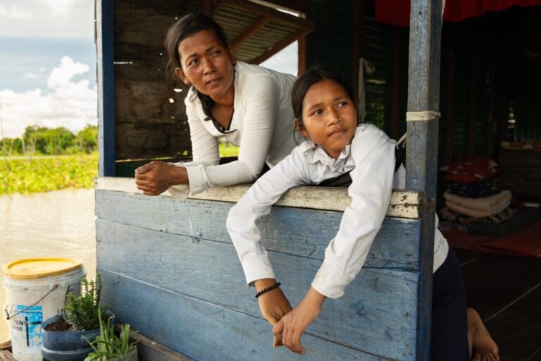 Nhim San, left, and her daughter, Sou Sreynich, at their home in a floating village on Cambodia's Tonle Sap Lake on Monday, June 29, 2026. (AP Photo/Anton L. Delgado)