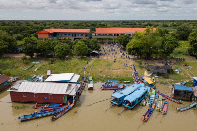 Students arrive at a school in a floating village on the Tonle Sap Lake, Cambodia, Tuesday, June 30, 2026. (AP Photo/Anton L. Delgado)
