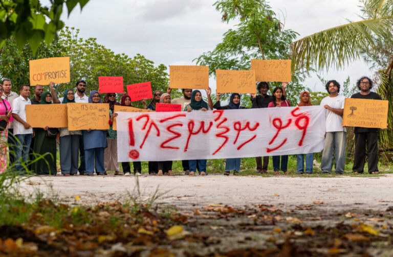 Members of Project ThimaaVeshi, team up with Veshi Saafu, a group of older women who also campaign on environmental matters, to demonstrate against ongoing reclamation projects on World Environmental Day in Addu City, Maldives, June 5, 2026. (AP Photo/Sophia Nasif)
