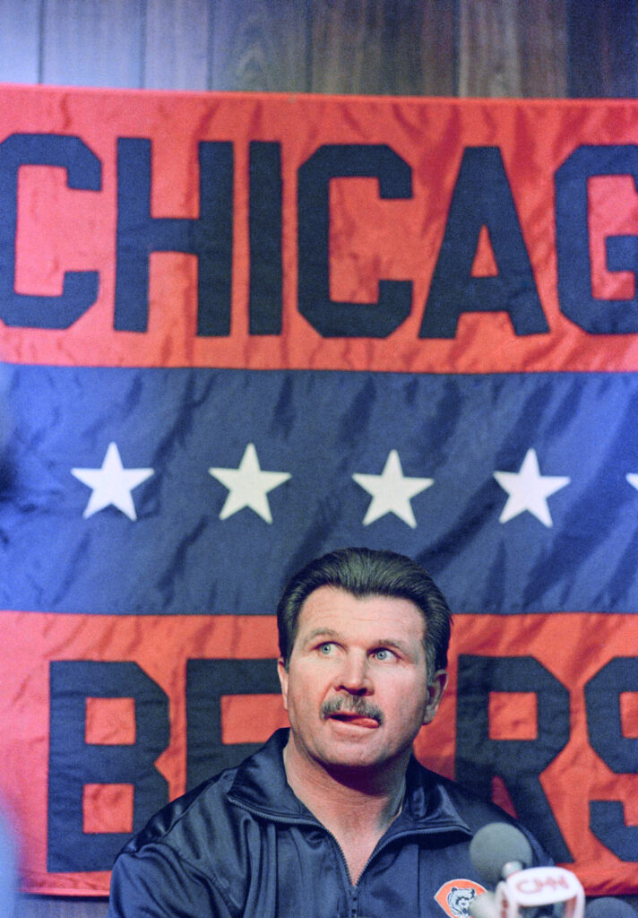Chicago Bears coach Mike Ditka fields question during an NFL football news conference, Jan. 9, 1985 in Suwanee, Ga. (AP Photo/Joe Holloway, Jr., File)